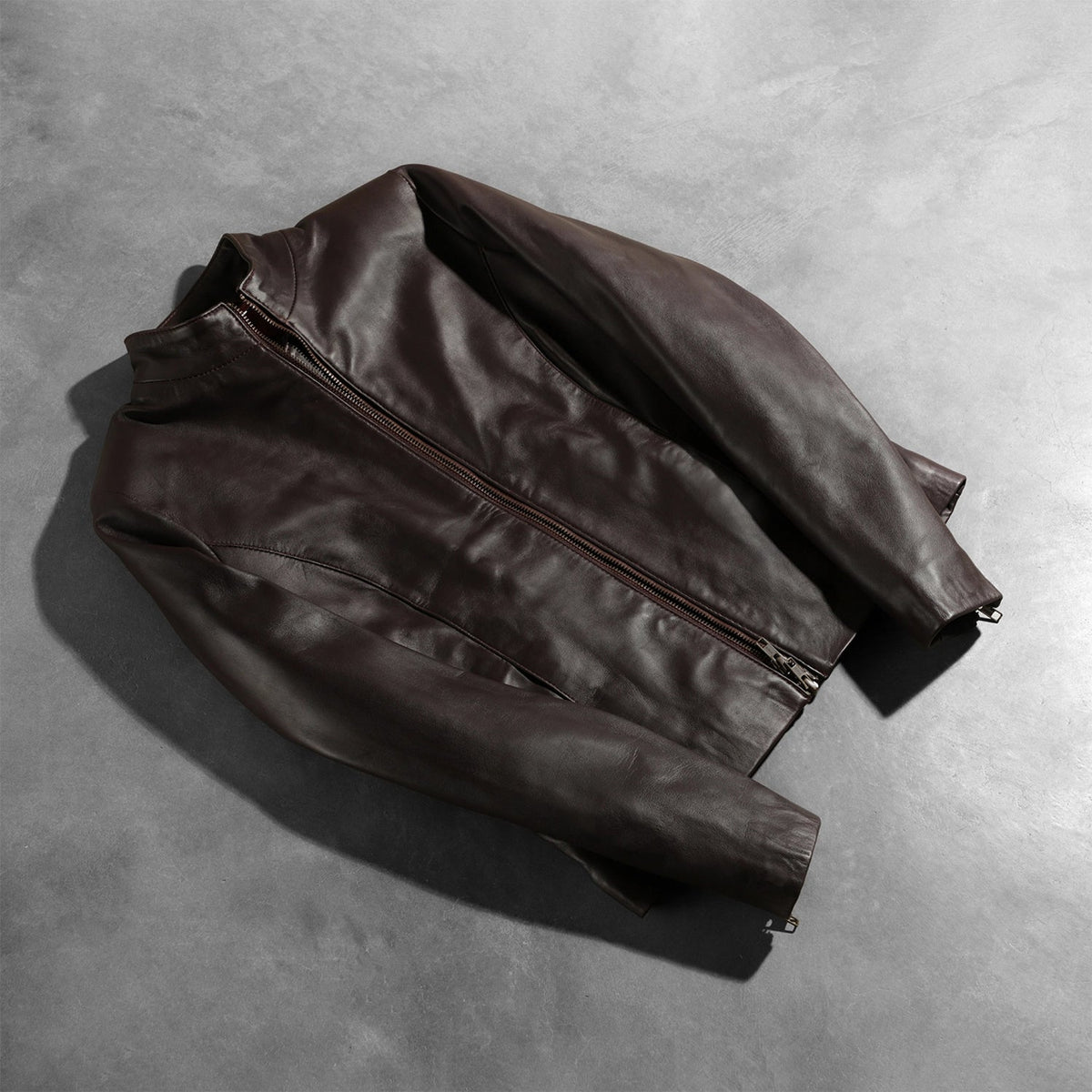 Zipper &amp; Hem Craftsmanship Construction Detail on Rumella Maroon Leather Biker Jacket