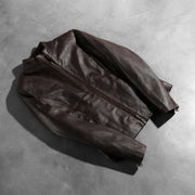 Zipper &amp; Hem Craftsmanship Construction Detail on Rumella Maroon Leather Biker Jacket