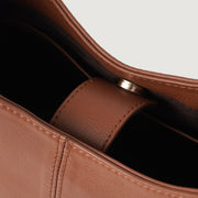
Perspective portée de The Stefani Brown Leather Hobo Bag For Women sur modèle - Tombé naturel à la lumière du jour